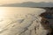 View on sandy beach of Sperlonga on sunset, ancient Italian city in province Latina on Tyrrhenian sea, tourists vacation