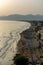 View on sandy beach of Sperlonga on sunset, ancient Italian city in province Latina on Tyrrhenian sea, tourists vacation