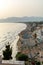 View on sandy beach of Sperlonga on sunset, ancient Italian city in province Latina on Tyrrhenian sea, tourists vacation