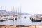 The view on Sanremo port full of sea boats, ships and yachts. Sanremo cityscape on the background