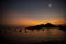 View from Sant Elm city towards Dragon island in Mallorca - sunset. Dusk sky with moon