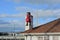 View of Santa Claus with bag crawling chimney