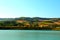 View from Santarelli lakes with green cultivations, pastures and meadows rolling over Marche hills