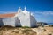 View of Santo EstevÃ£o (St Stephen\'s chapel), a temple built in the rock in Baleal village, Peniche, Portugal