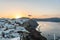 View of Santorini cliff houses and the Caldera at sunrise