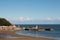 view of scarborough south bay with lighthouse harbour and town on a sunlit summer day