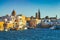 View of scenic city scape and a fishing harbor with marina in Monopoli, Italy