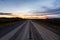 View of Scenic Road leading to Tombstone at Sunrise in Canadian Nature.