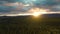 View of Scenic Valley surrounded by Mountains at Sunset