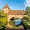 View at the Schlayerturm Tower with Bridge over Pegnitz river in Nuremberg ,Germany