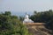 View of a sculpture of seated Buddha in the early morning. Sri Lanka