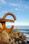 View of sculptures of the comb of the Wind, at dawn with blue sky, in vertical, in San Sebastian, Basque Country, Spain.