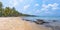 View of the sea and the beach with palmtrees of a tropical island