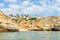 View from the sea of Carvoeiro beach. The Lagoa region has a coastline formed of towering cliffs, turquoise waters and picturesque