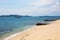 View of the sea, coast, ship with tourists arriving to the port of Ouranoupoli village, Greece