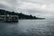 View of the sea, dock, mountains and city.