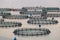 View of sea fish farm cages and fishing nets, farming dorado, sea bream and sea bass, process of feeding the fish a forage, with