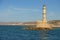 View at the sea and lighthouse tower at the rocky promontory