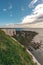 View of sea at low tide and empty beach with Chalk Cliff Arch in Margate, England