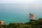 View of sea and rocky wooded coast