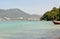 View of the sea, sky and mountains overgrown with jungle Tri Trang Beach in Phuket