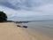 View of the sea and sky There are canoes moored on the sandy beach.