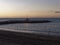 View of the sea and stones on the Pedregalejo Beach at dusk