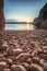 view of the sea in the sunrise, hidden stone beach at Vibnik Krk in Croatia