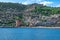 View from the sea to the Old City of Alanya Turkey with the Red Tower on the background of turquoise water. Panorama of a town