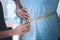 View of seamstresses hands measuring clients waist