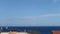 View of a seaplane flying over the coastline.