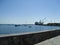 View of the seaport with shore cranes, ships and boats.