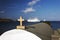 A view of a seascape, cruise ship and a church in the island of Patmos, Greece in summer time