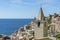 View of the seaside village of Riomaggiore and the Church of San Giovanni Battista, Cinque Terre, Liguria, Italy