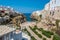 The view seaward of the coastal inlet and beach at Polignano a Mare, Puglia, Italy