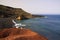 View on secluded lagoon surrounded by impressive rugged weathered cliffs in different colors - El Golfo, Lanzarote