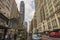 View of seemingly endless New York City street disappearing into horizon, flanked by towering buildings