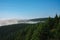 View from  Serak in Jeseniky mountains on a summer foggy morning and  sea of clouds around mountain peak