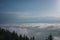 View from  Serak in Jeseniky mountains on a summer foggy morning and  sea of clouds around mountain peak