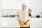 view of serviceman fixing cabinet with screwdriver in kitchen