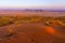 View of Sesriem at sunset from the top of the Elim dune in Namibia.