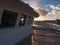 View of setting sun across deck and pilot house of ship in San Juan Harbor in Puerto Rico