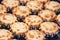 View of several freshly baked cakes in metal tins