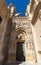 View of Seville Cathedral entry gate with the Giralda in the background