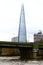 View of the Shard from the river Thames just around the bend from the Cannon Street Railway Bridge and Station.