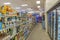 View of shelves with products and refrigerators with refreshing drinks in the CVS store.