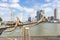 View through the ship`s ropes and the bowsprit of a sailing ship on the imposing buildings at the Erasmus bridge