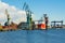 View of the shipyard with historical cranes in the industrial part of the city Gdansk GdaÅ„sk in Poland Polska. The shipyard is