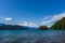 View from the shore to Harrison Lake british columbia Canada green land blue water and sky