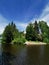 View from the shore of the Vyborg Bay to the island of Ludwigstein with the Ludwigsburg Chapel in the Monrepos Rock Nature Park in